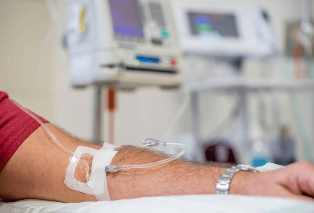 A patient receiving sublingual allergen immunotherapy drops under the tongue